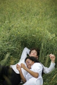 A shot of a happy relaxing couple demonstrates the joy of achieving a permanent penis enlargement when in love.