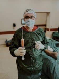 An image of a surgeon about to carry out penis surgery, a procedure that rarely delivers permanent penis enlargement results.