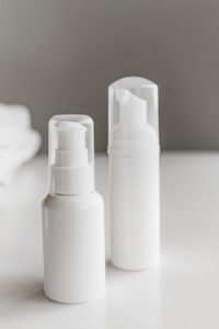 White plastic bottles containing penis enlargement cream for permanent lifetime enlargement