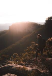 A picture of a guy in the wilderness relaxing illustrates one of the tricks of getting better in bed.