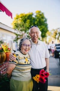 A picture of a joyful aging couple demonstrates the benefits of gaining the confidence of having prevented the effects of a shrinking penis.