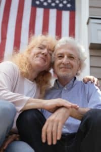 A picture of an elderly couple illustrates that couples can age happily, having used penis enlargement products that prevent and reverse the effects of a shrinking penis.